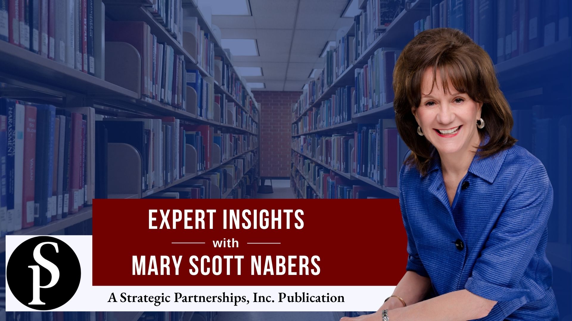 Mary Scott Nabers before an isle of books at a library for her weekly column.