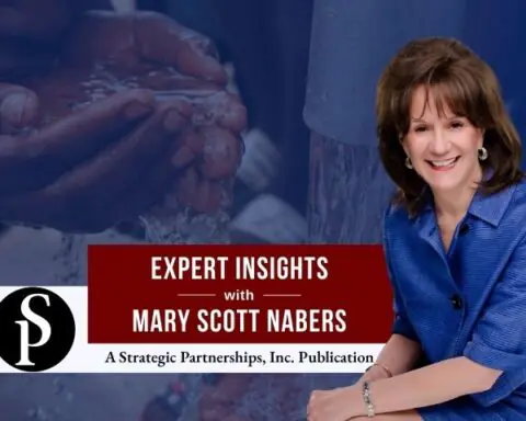 Mary Scott Nabers before water and a child's hands for her weekly column.