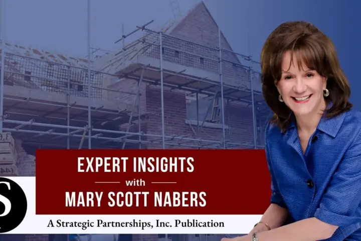 Mary Scott Nabers before a building under construction for her weekly column.