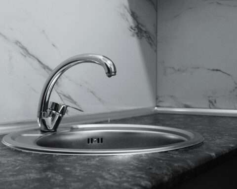 A silver water faucet.