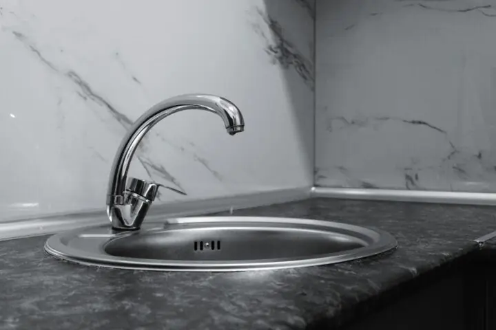 A silver water faucet.