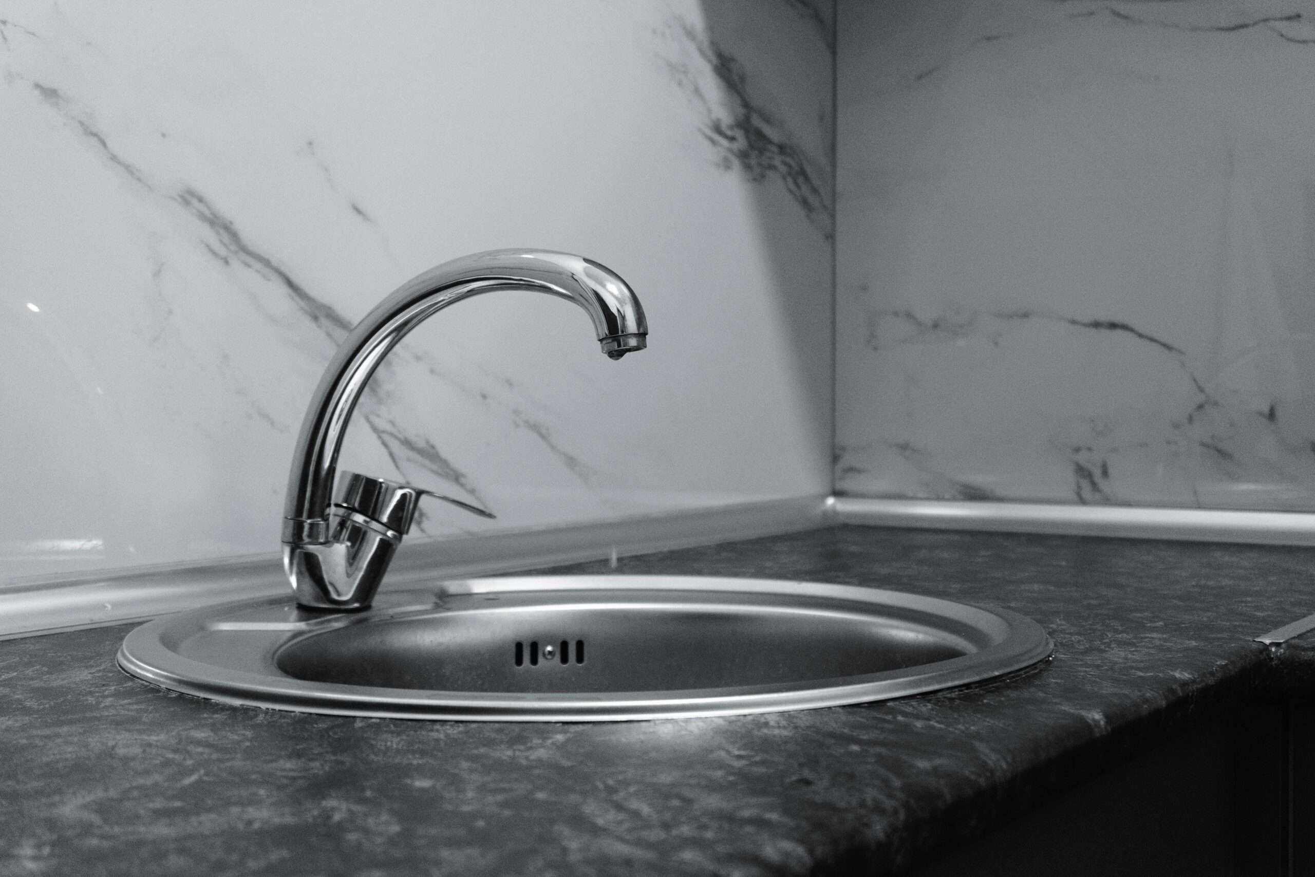 A silver water faucet.