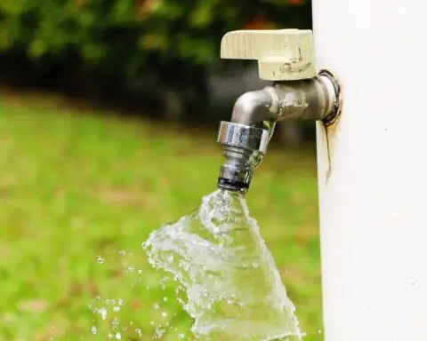 A water spout on the exterior of a house.