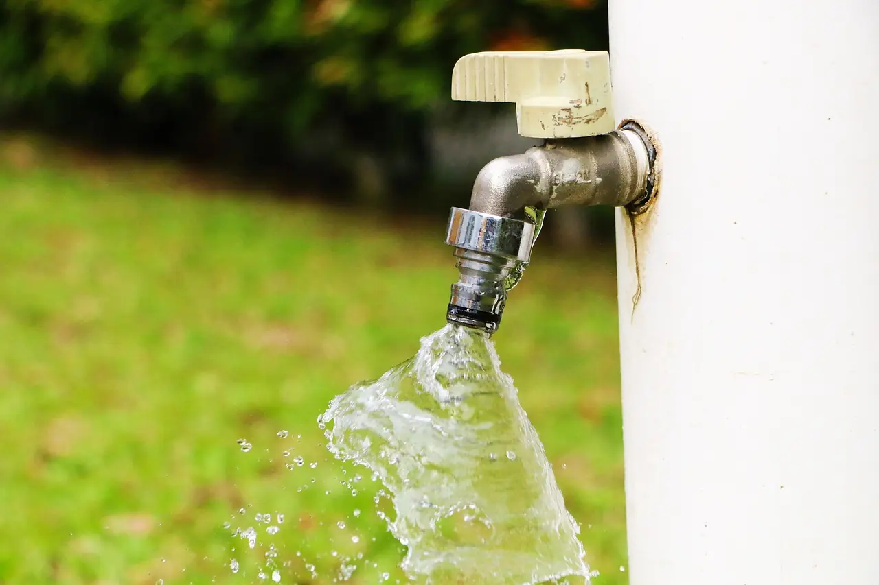 A water spout on the exterior of a house.