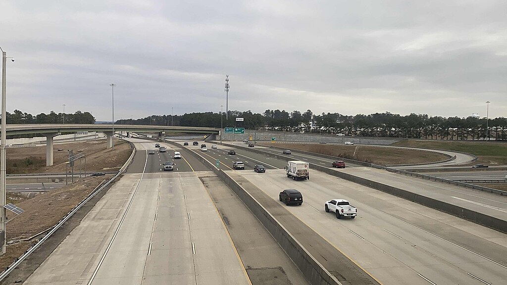 I-20 from above with cars in both directions on a cloudy day.