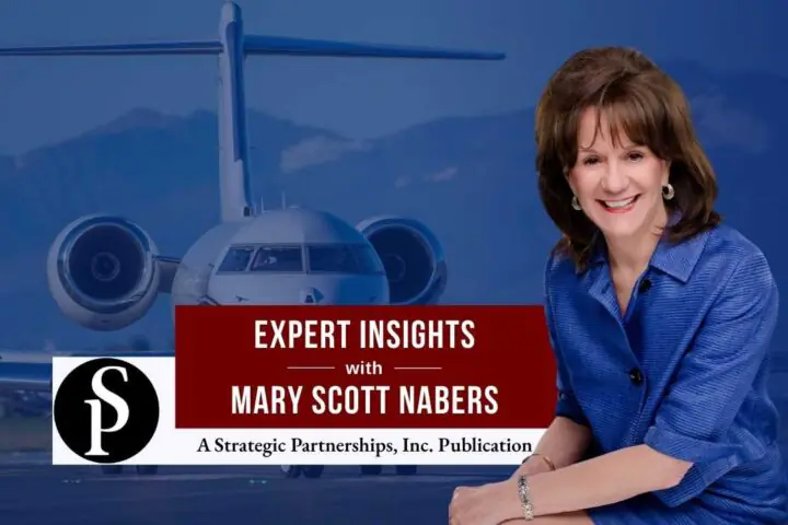 Mary Scott Nabers before a landed airplane for her weekly column.