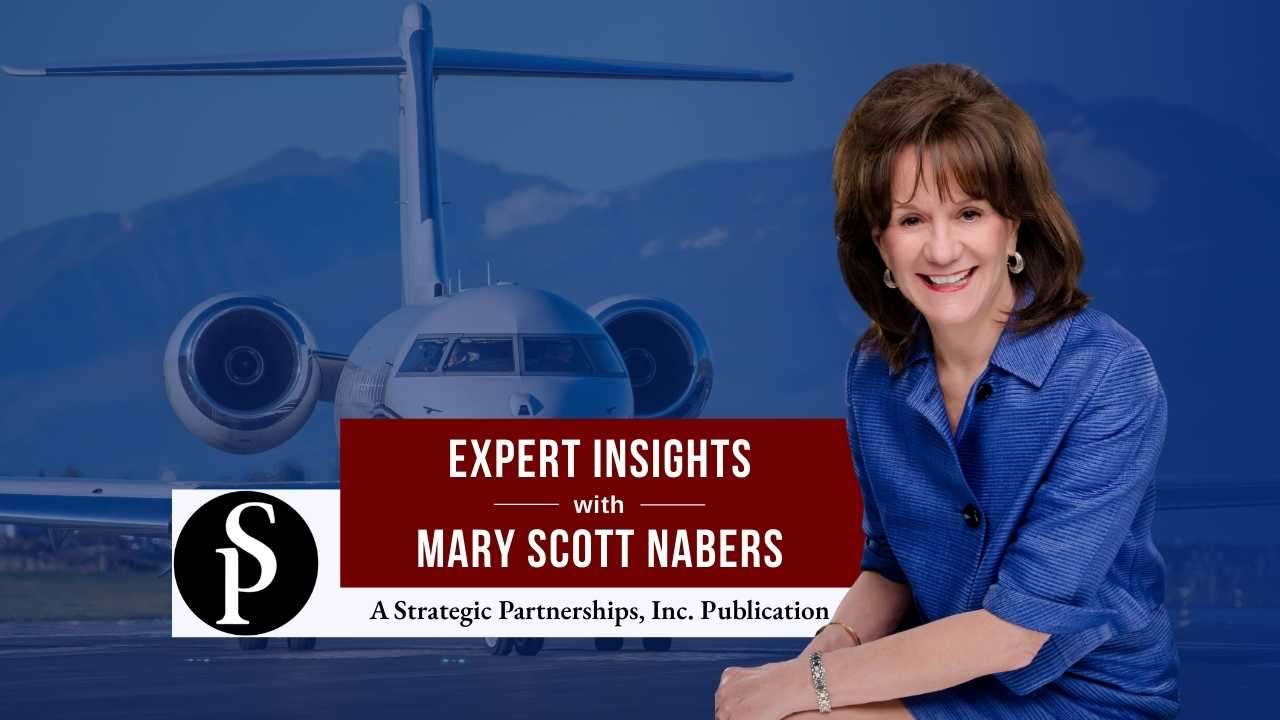 Mary Scott Nabers before a landed airplane for her weekly column.