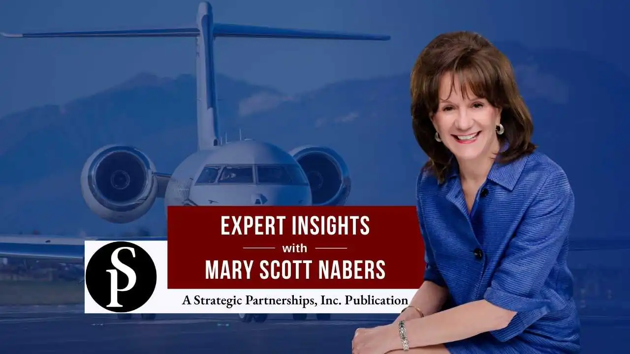 Mary Scott Nabers before a landed airplane for her weekly column.