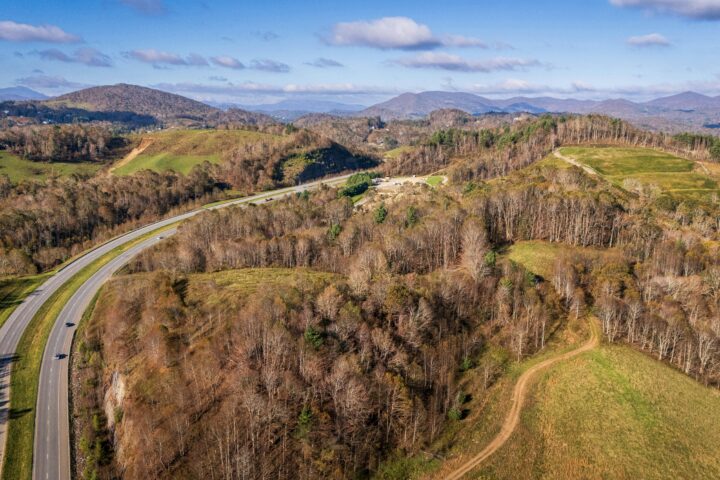 An aerial view of Boone North Carolina's forest nearby a highway.