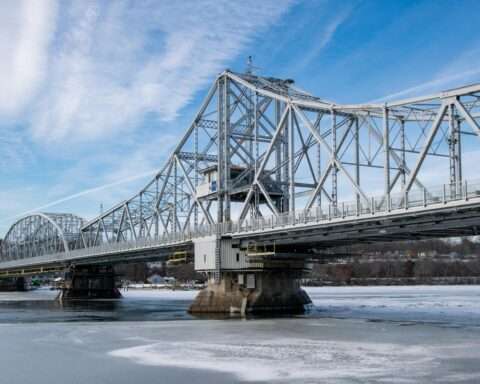 A bridge in Connecticut over a cold watery lake.