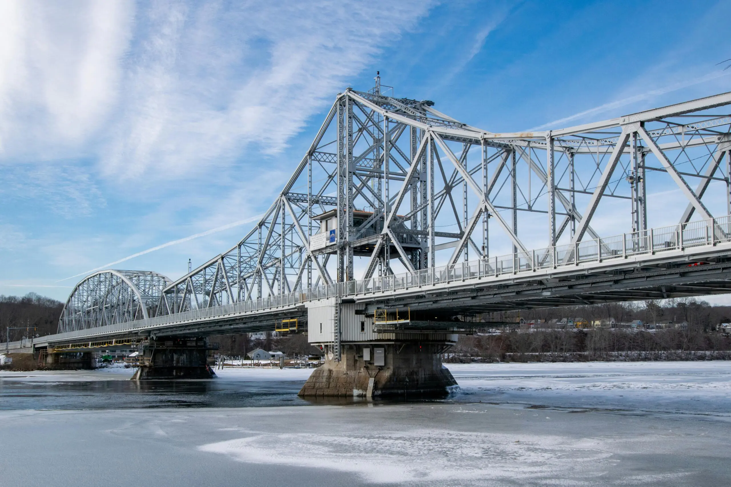 A bridge in Connecticut over a cold watery lake.