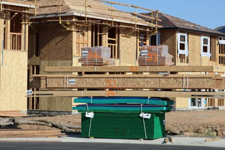 Housing developments under construction on a sunny day.
