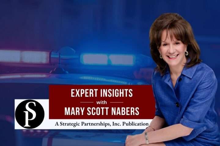 Mary Scott Nabers before a police car for her weekly column.