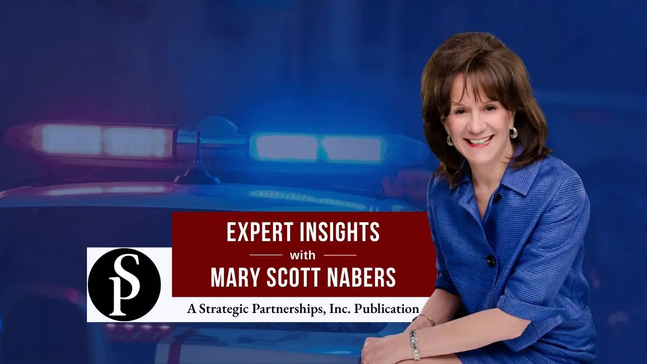 Mary Scott Nabers before a police car for her weekly column.