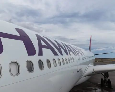 A Hawaiian Airlines plane on the tarmac of a Hawaiian airport.