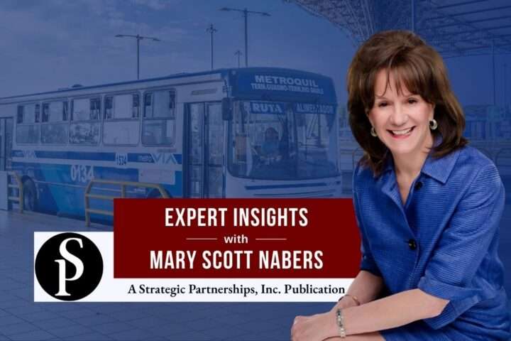 Mary Scott Nabers before a bus at a bus station for her weekly column.