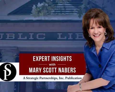 Mary Scott Nabers before a public library sign for her weekly column.