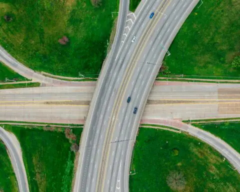 An aerial view of a highway intersection or interchange.