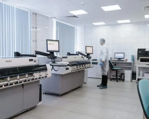 Machines and an employee in a research laboratory.