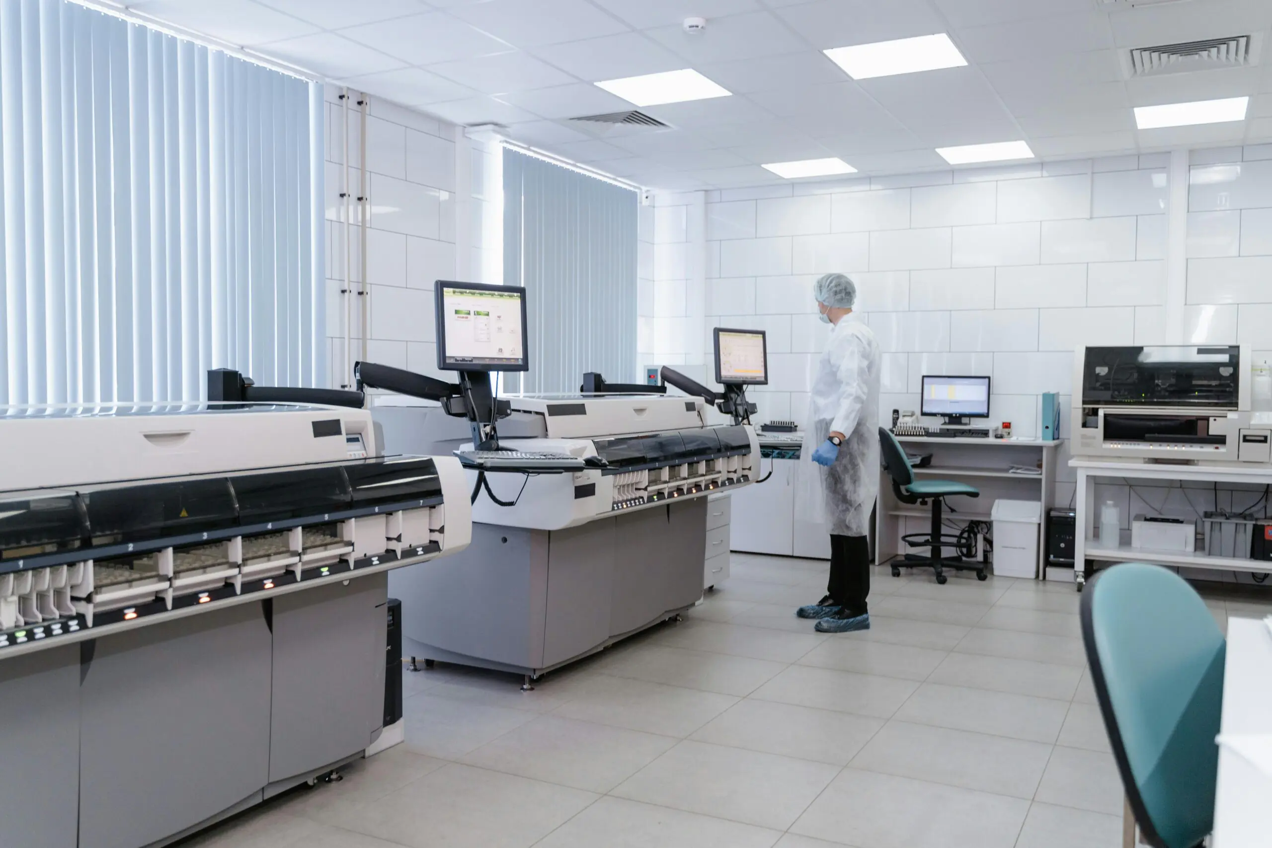 Machines and an employee in a research laboratory.