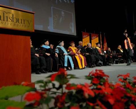 Maryland's Lt. Governor makes an announcement at the performing arts center at Salisbury University.