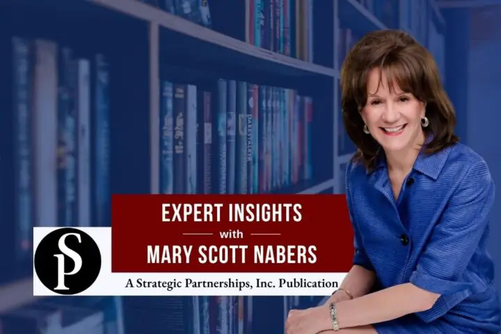 Mary Scott Nabers before a library with books for her weekly column.