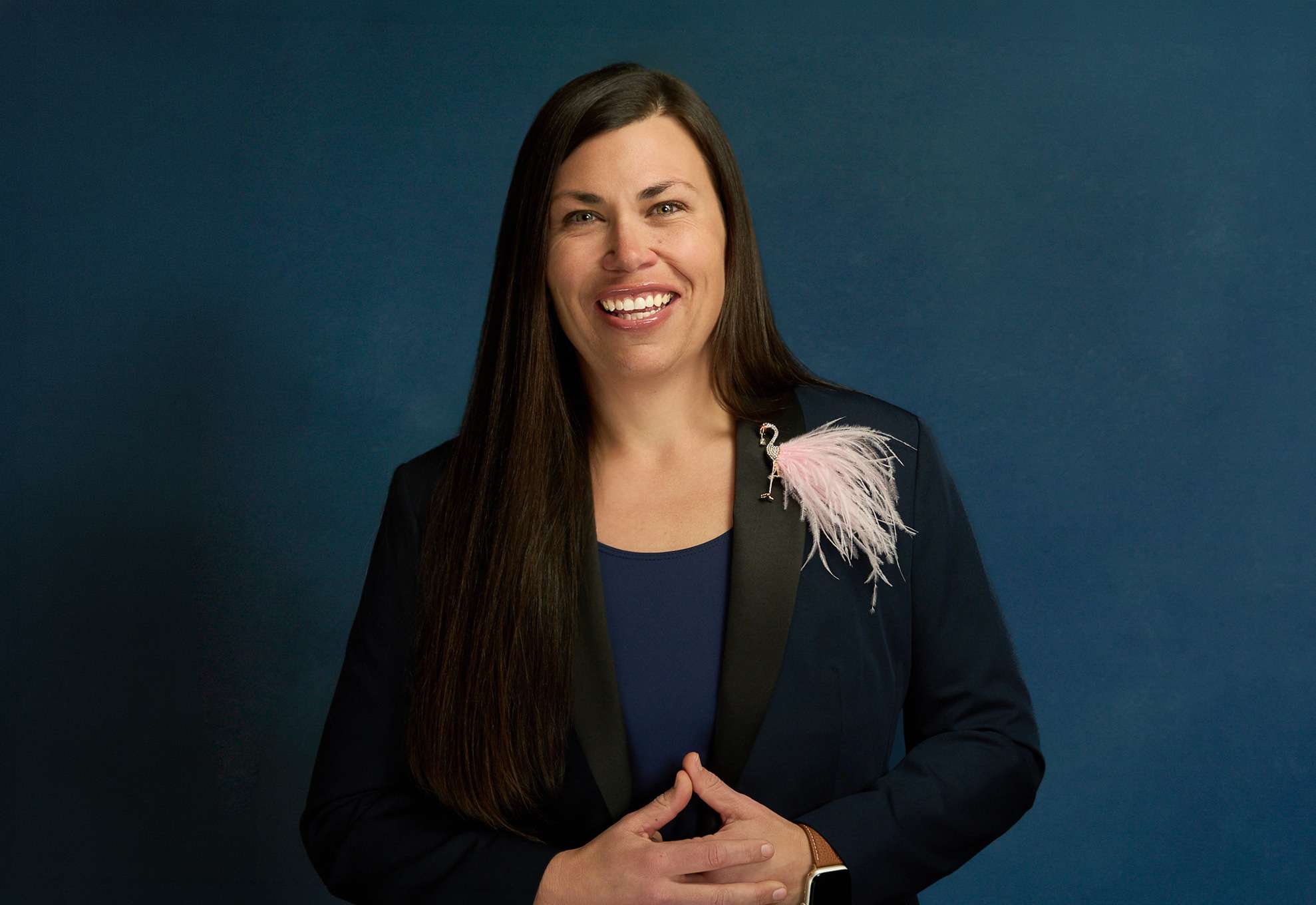 A portrait of Mayor Lacey Beaty before a blue background in Beaverton, Oregon.