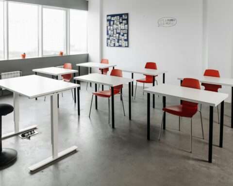 An empty middle school classroom on a sunny day.