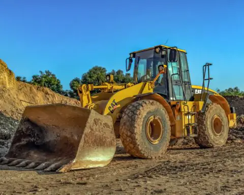 A bulldozer on dirt.