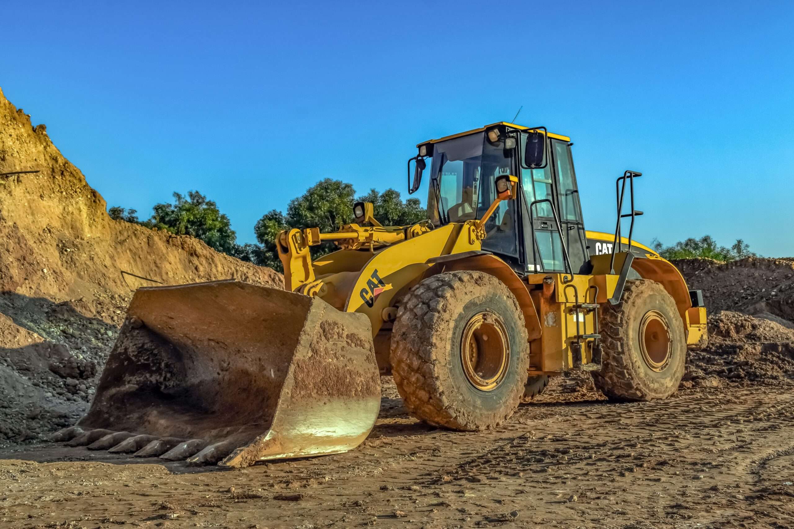 A bulldozer on dirt.