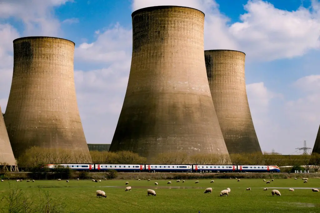 Nuclear silos before a blue cloudy sky.