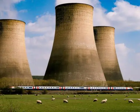 Nuclear silos before a blue cloudy sky.