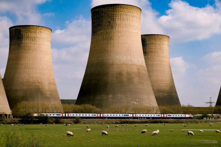 Nuclear silos before a blue cloudy sky.