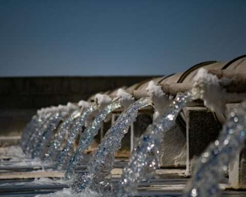 Water pouring from a series of pipes.