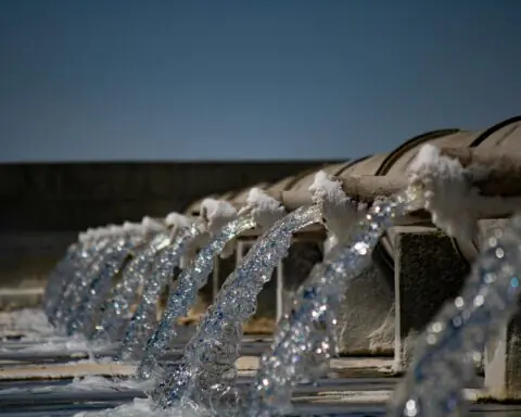 Water pouring from a series of pipes.