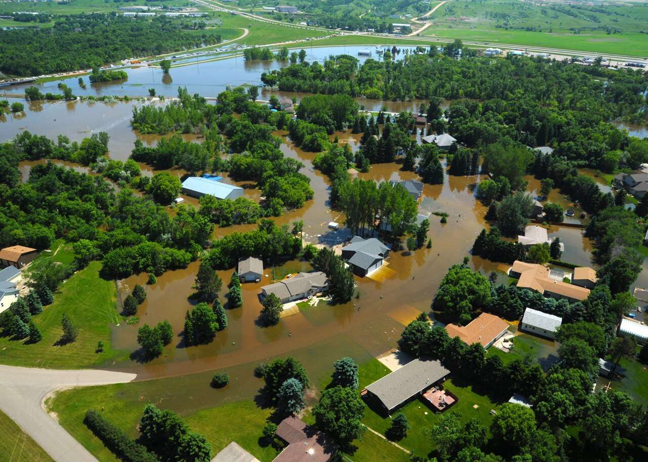 MINOT, N.D. -- Water engulfs a neighborhood in Minot, N.D., June 23, 2011. As many as 10,000 residents, about one-fourth of the city's population, have evacuated as the fast-rising Souris River inundates thousands of homes and businesses. The deluge from the Souris River is expected to exceed that of the city's historical 1969 flood, making this the region's worst flooding in four decades. (U.S. Air Force photo by Staff Sgt. Sharida Jackson) (RELEASED)