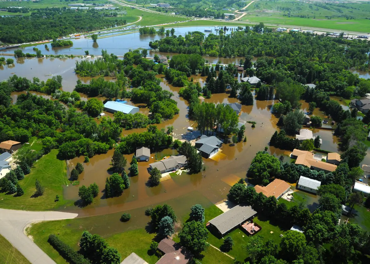 MINOT, N.D. -- Water engulfs a neighborhood in Minot, N.D., June 23, 2011. As many as 10,000 residents, about one-fourth of the city's population, have evacuated as the fast-rising Souris River inundates thousands of homes and businesses. The deluge from the Souris River is expected to exceed that of the city's historical 1969 flood, making this the region's worst flooding in four decades. (U.S. Air Force photo by Staff Sgt. Sharida Jackson) (RELEASED)