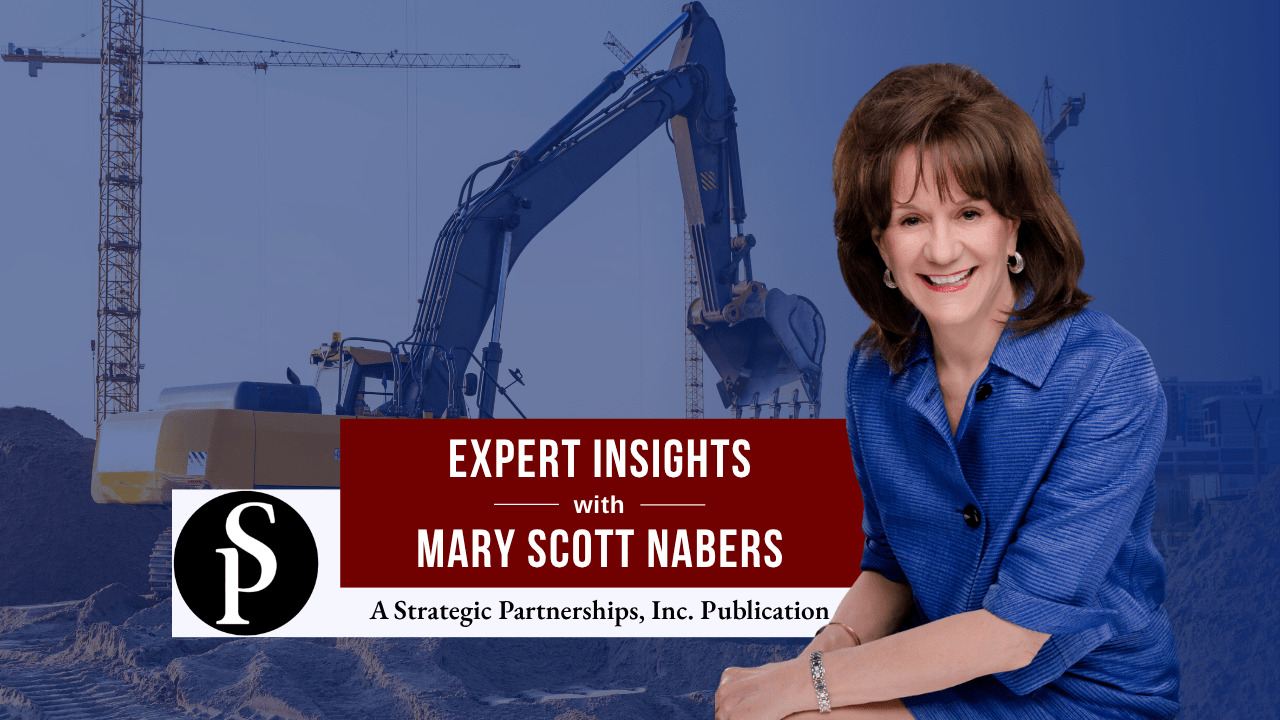 Mary Scott Nabers before construction equipment.